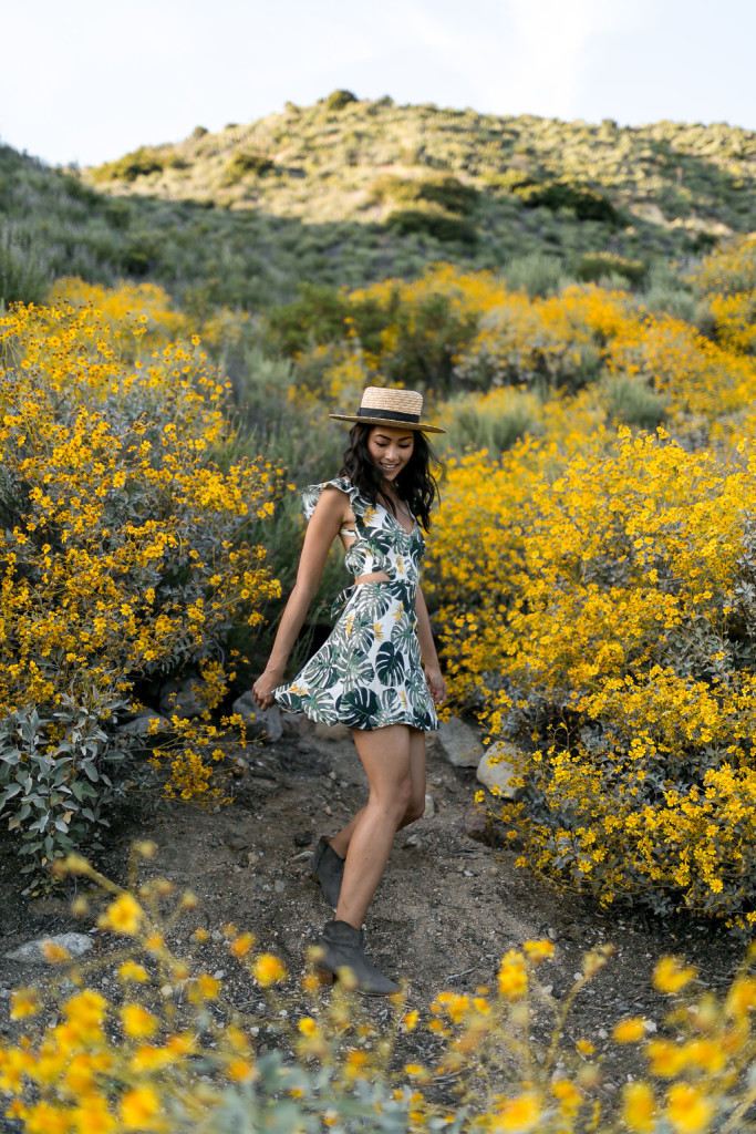 Amy Zhang wearing Tropical Palm Print dress, hat, and boots