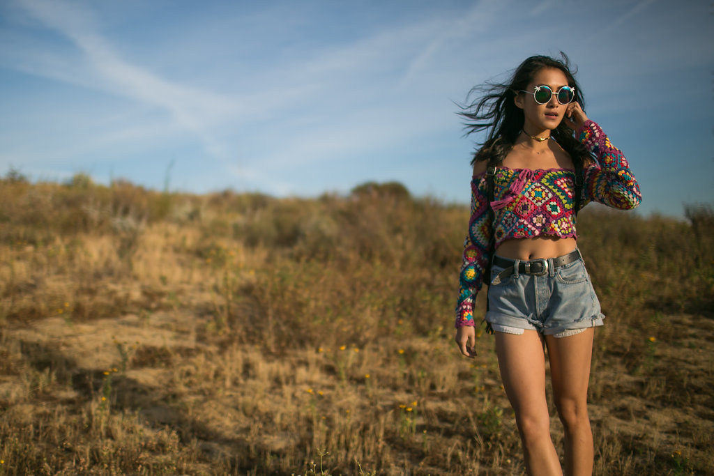 Amy Zhang using fringe backpack and wearing Spell Carnaby Crochet Top Festival Style  for her Coachella Outfits