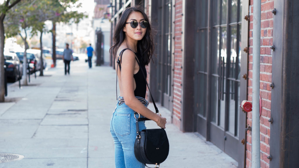Amy Zhang wearing Affordable Denim Brands On Trend and black cutout top