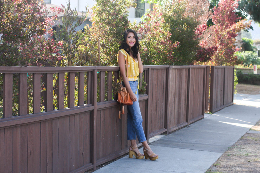 Amy Zhang wearing yellow peasant top and Topshop Cropped Flares 