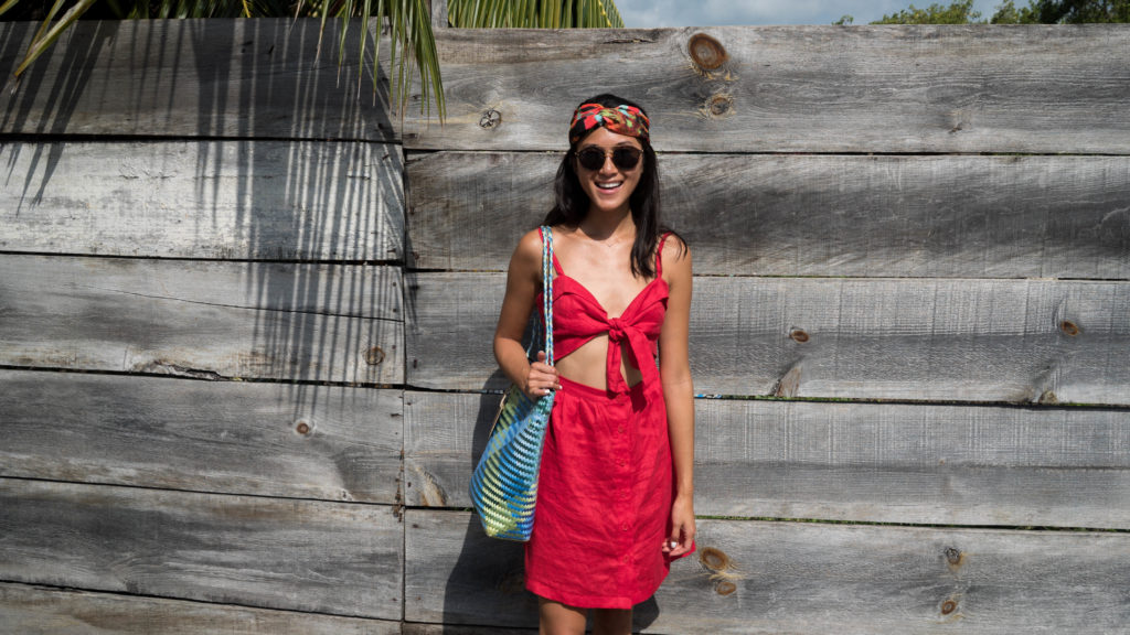 Amy Zhang The Luxi Look wearing red Reformation Dress Tulum