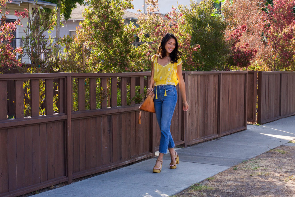 woman wearing yellow top and Topshop Cropped Flares 