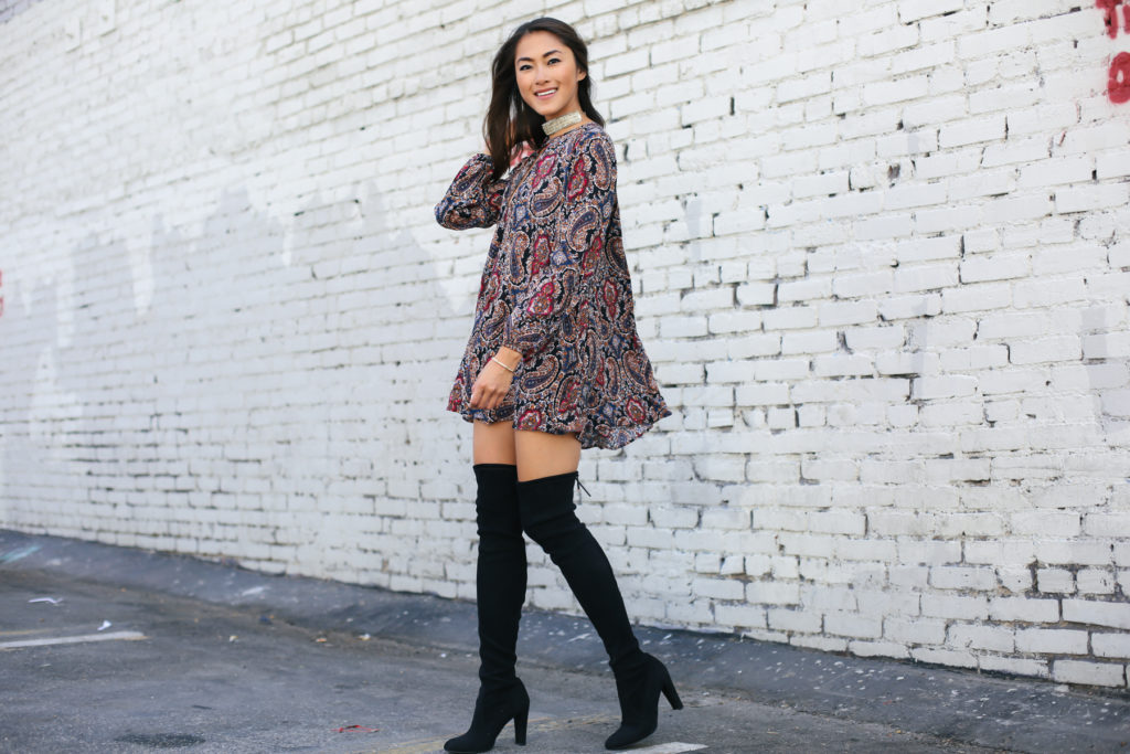 woman wearing Investment Pieces dress and boots