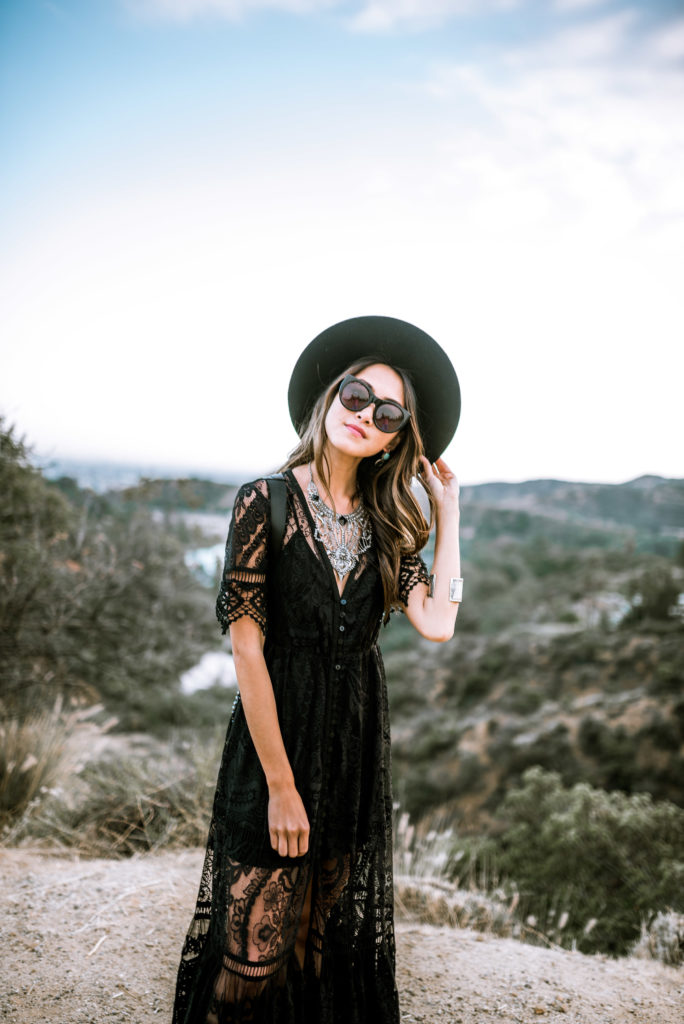 woman wearing Sticks + Stones black lace dress
