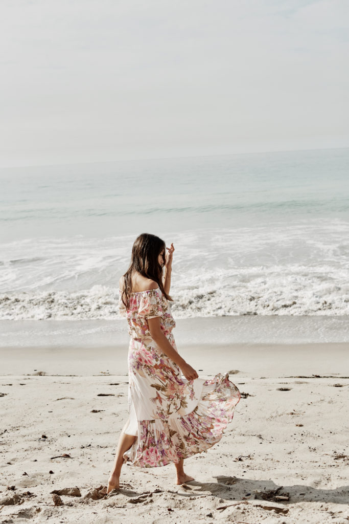 woman walking at the beach sharing the benefits of Practicing Gratitude