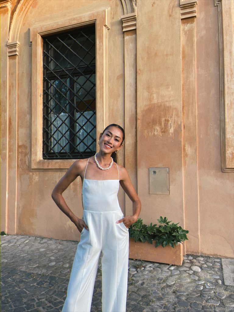 woman Wore in Italy a NBD Revolve Prosecco White Jumpsuit outfit